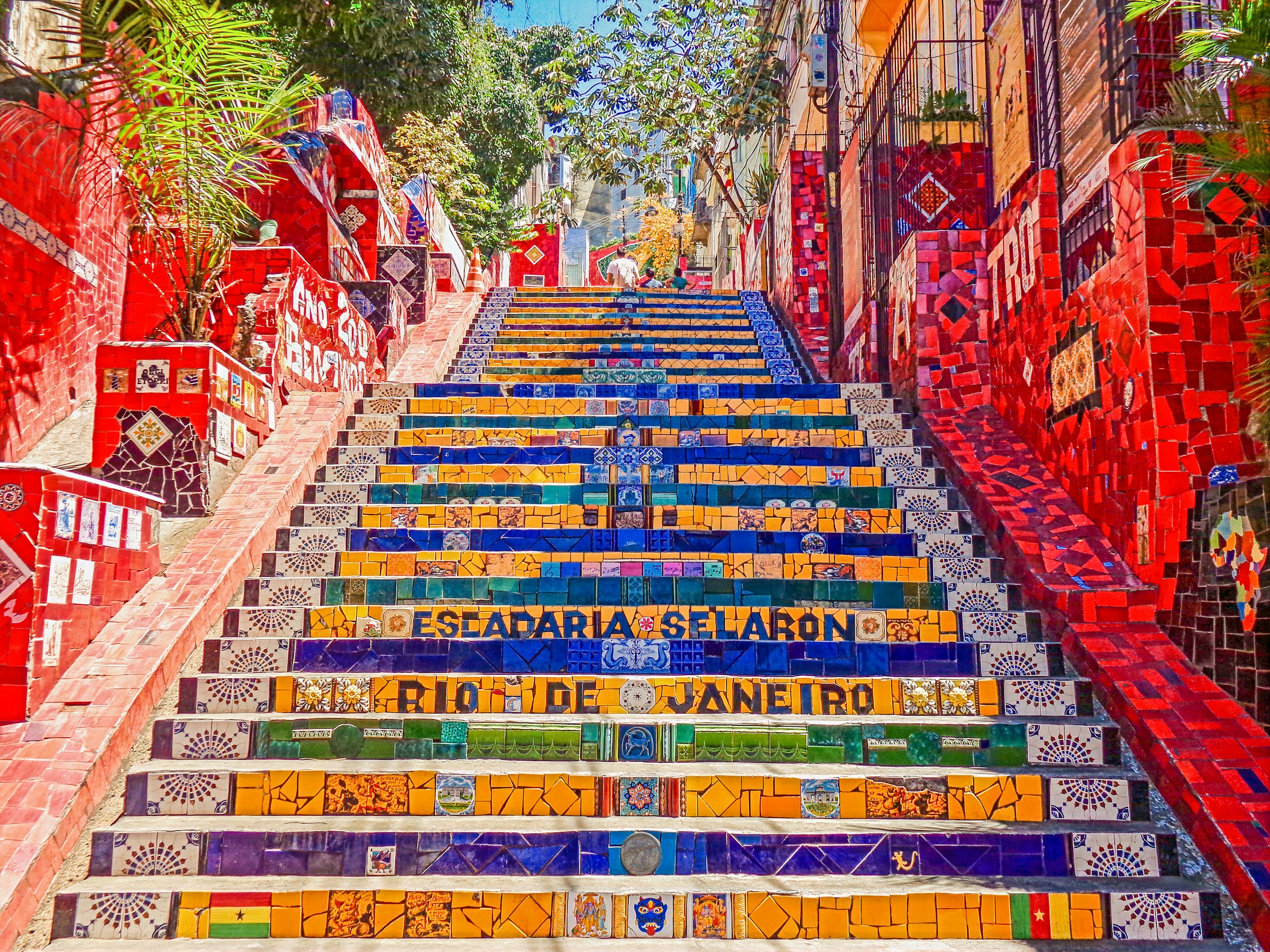 Colorful Escadaria Selarón in Rio de Janeiro, featuring vibrant tiled steps and red mosaic walls.