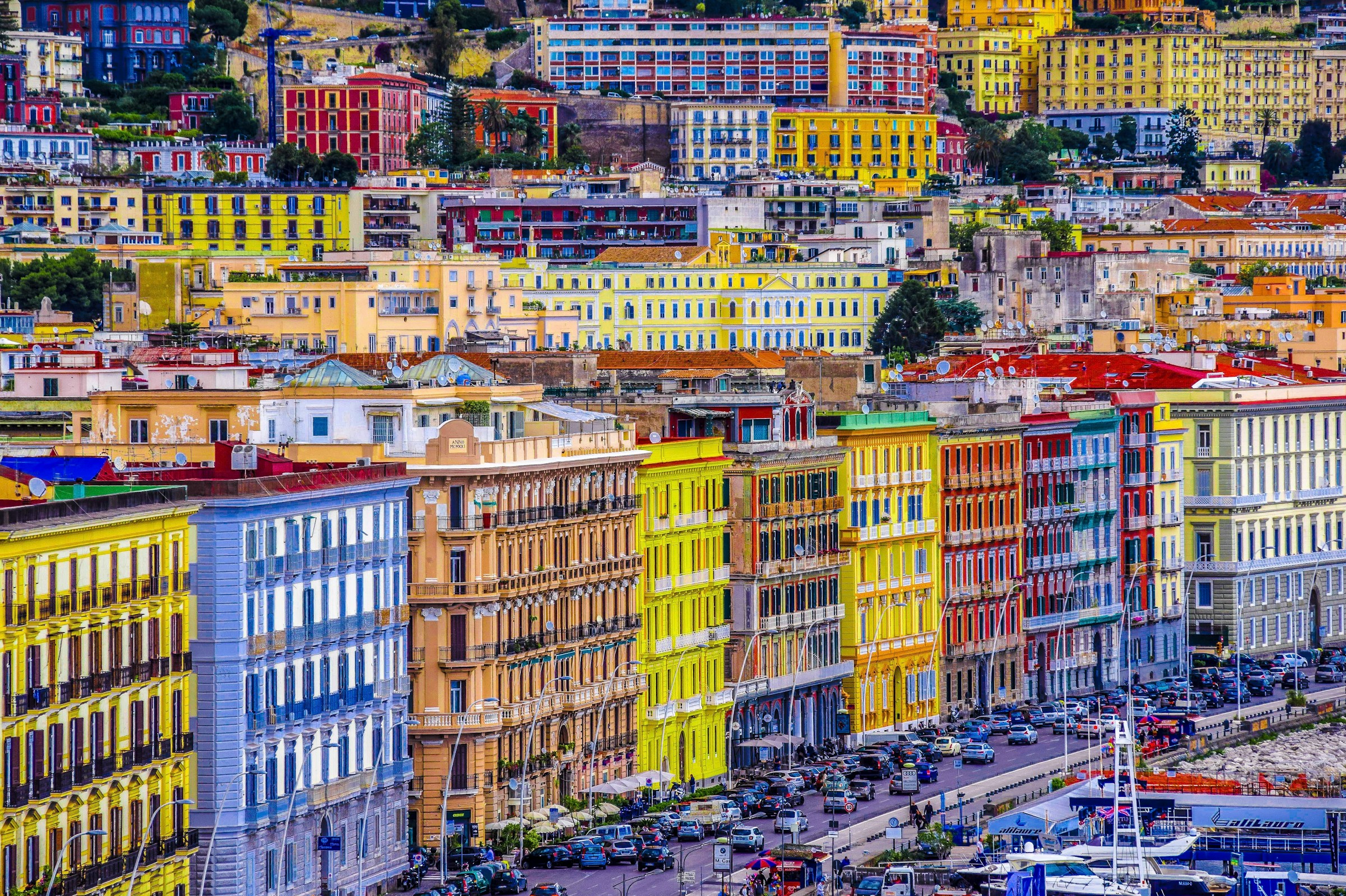 Colorful hillside buildings in Naples, Italy, showcasing vibrant architecture and urban landscape.