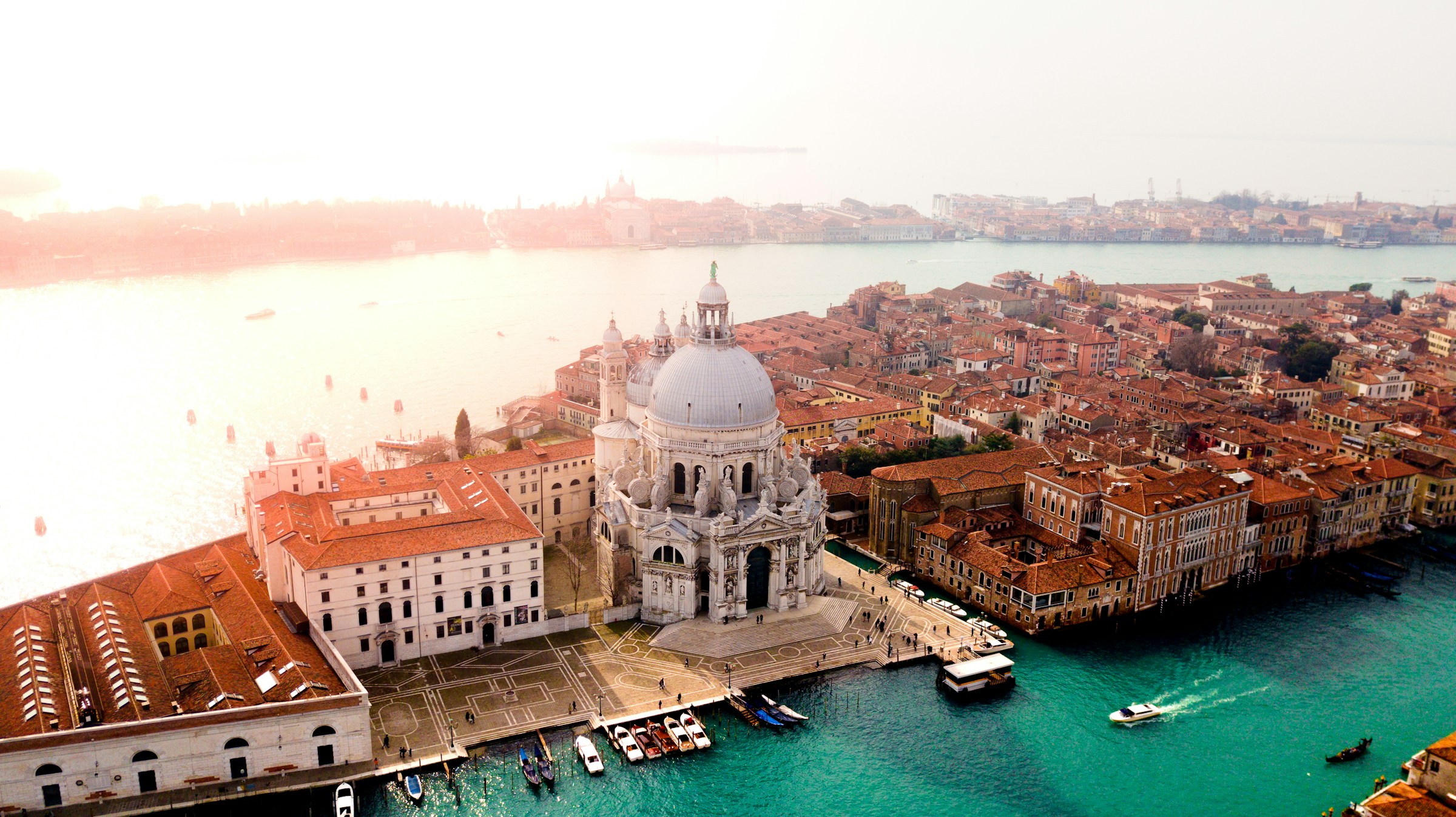 Aerial view of the Basilica di Santa Maria della Salute, a historic Baroque church in Venice, Italy, surrounded by the Grand Canal.
